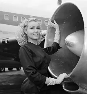Julie Newmar Posing by Jet Engine