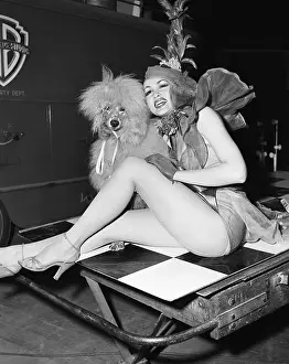 Costume Prints: Julie Newmar Seated With Poodle