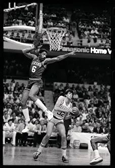 Julius Erving Leaping in Air to Block Opponent's Shot