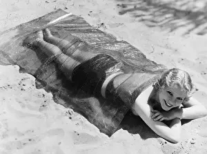 Lying Down Prints: June Clyde Tanning In Cellophane