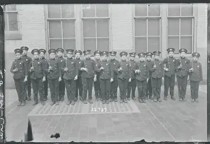 Precision Prints: Juvenile Police Standing at Attention