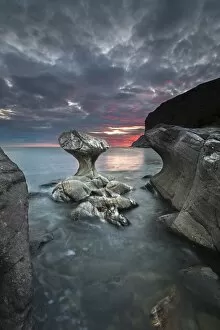 Kannestein or Kanne Stone with coastline at sunset, Vagsoy island, Sogn og Fjordane, Norway
