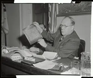 Karl E Prints: Karl Mundt Holding Papers as Evidence in Hearing