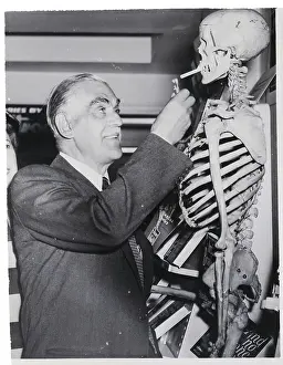 Dracula Prints: Karloff Lights Cigarette for Skeleton