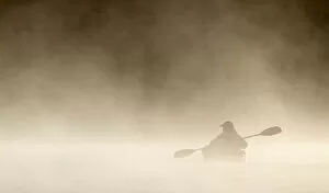 Images Dated 22nd June 2014: Kayaking photographer in the fog