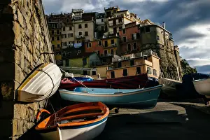 Kayak Prints: Kayaks with colorful houses of Manarola village in Cinque Terre National Park