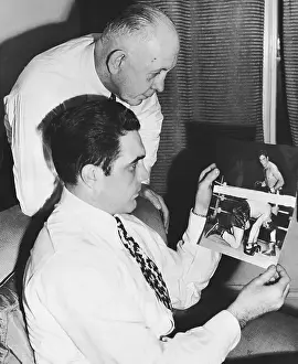 Kearns and Maxim Looking Over Fight Photo
