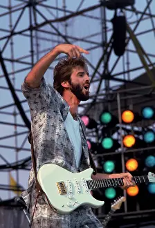 Iconic Concert Prints: Celebrate the Unforgettable Music Event That United the World: Kenny Loggins Performing