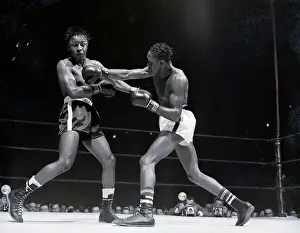 Kid Gavilan Punches Johnny Bratton