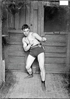 Prints of Boxer, Kid Herman, leaning back, left fist extended and right fist drawn back to stomach in a room in the Chicago Daily News building, Chicago, Illinois, 1906 In the Ring: The Art of Boxing: Kid Herman
