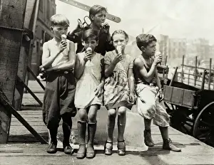 Kids Sitting on Ice Block Eating Ice Cream Cones