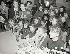Prints of (Original Caption) 5/9/1948-Chicago, IL: These Chicago kids now have a place of their own to watch television shows Timeless TV: A Visual Journey: Kids Watch Tv In Candy Store/Soda Parlor