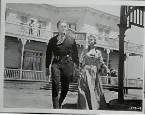 Kirk Douglas and Carol Lynley Walking Across Western Set