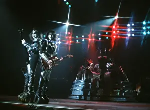 Prints of LOS ANGELES - CIRCA 1977: Gene Simmons, Paul Stanley and Ace Frehley of the rock and roll band Kiss performing onstage in circa 1977. (Photo by Michael Ochs Archives/Getty Images) Icons Unmasked: Kiss Performing