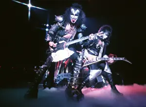 Prints of CIRCA 1977: (L-R). Gene Simmons of the rock and roll band Kiss performs onstage in circa 1977. (Photo by Michael Ochs Archives/Getty Images) Icons Unmasked: Kiss Performing