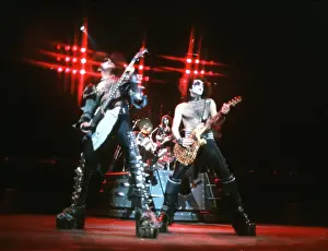 Prints of CIRCA 1977: (L-R). Gene Simmons of the rock and roll band Kiss performs onstage in circa 1977. (Photo by Michael Ochs Archives/Getty Images) Icons Unmasked: Kiss Performing