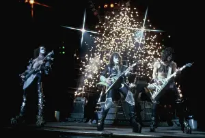 Prints of CIRCA 1977: (L-R). Gene Simmons, Ace Frehley and Paul Stanley of the rock and roll band Kiss perform onstage in circa 1977. (Photo by Michael Ochs Archives/Getty Images) Icons Unmasked: Kiss Performing