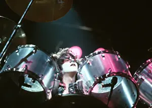 Prints of LOS ANGELES - CIRCA 1983: Eric Carr (drummer 1982-4) of the rock and roll band Kiss performs onstage in circa 1983 in Los Angeles, California. (Photo by Michael Ochs Archives/Getty Images) Icons Unmasked: Kiss Performing