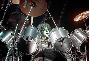 Prints of CIRCA 1985: Drummer Eric Carr of the rock and roll band Kiss performs onstage in circa 1977 (Photo by Michael Ochs Archives/Getty Images) Icons Unmasked: Kiss Performing