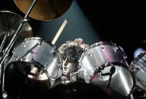 Prints of CIRCA 1985: Drummer Eric Carr of the rock and roll band Kiss performs onstage in circa 1977 (Photo by Michael Ochs Archives/Getty Images) Icons Unmasked: Kiss Performing