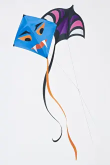 Playing Prints: Kite fighting, two colourful kites flying with their lines crossing