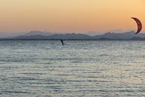 Oman Prints: Kitesurfer, surfing on the blue lagoon of Ras Al Hadd Lagoon in the evening light