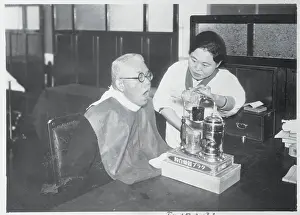 Kiyoshi Akita Receiving Throat Treatment