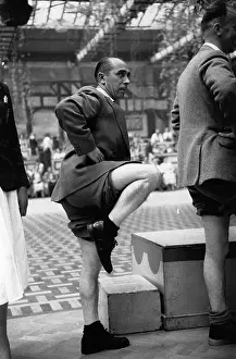 Prints of A contestant in a Butlin's knobbly knees contest. Original Publication: Picture Post - 6589 - Picture Post Visits a Holiday Camp - pub. 1953 (Photo by Frank Pocklington/Getty Images) A Tribute in Images to a Golden Era of Photojournalism: Knobbly Knees Contest