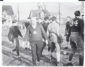 Knute Rockne and Football Players Practicing on Field