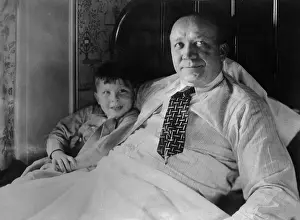 Knute Rockne and Son Jackie Sitting in Chair