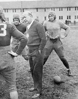 Illinois Prints: Knute Rockne Talking with Football Players on Field