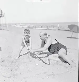 Knute Rockne Teaching Young Son Golf