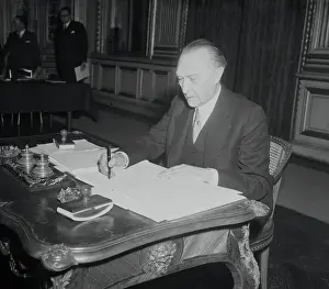 Konrad Adenauer Signing a Document