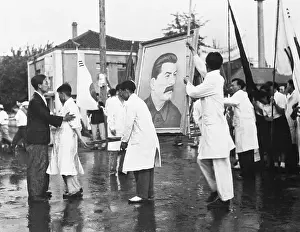 Koreans Prepare Stalin Portrait Outside