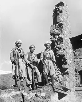 Kurdish Rebels Stand on Building Ruins