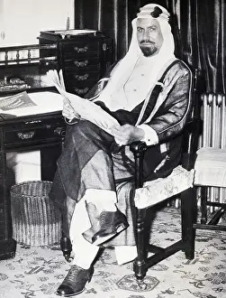 Kuwaiti Emir Reads Paper in Hotel Room