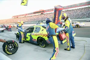 Prints of American stock car racer Kyle Bush's crew at the Sony HD 500 in 2005 in Fontana, California. (Photo by Gregory Bojorquez/Getty Images) Chasing Speed: Motorsport in Motion: Kyle Busch