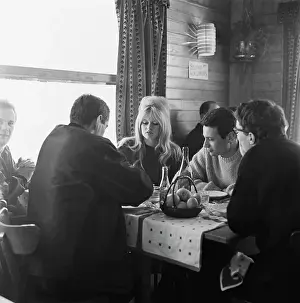 Prints of French actress Brigitte Bardot and co-star Michael Subor (next to her) at Villard-de-Lans in France, during the filming of La bride sur le cou, aka Please, Not Now!, 1961 Iconic Movie Star Prints (1920s–1970s): La Bride Sur Le Cou