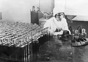 Laboratory Prints: Lab Assistant Filling Specimen Bottles