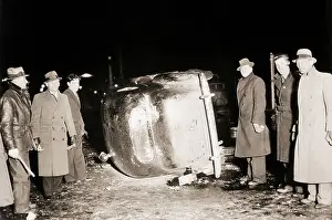 Labor Strikers Stand by Overturned Car