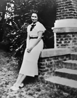 Lady Bird Johnson Leaning on Brick Entrance