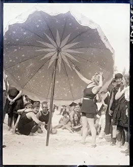 Fashion Design Prints: Lady Stands Under Huge Beach Umbrella