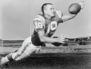 Lance Alworth Going up to Catch Football