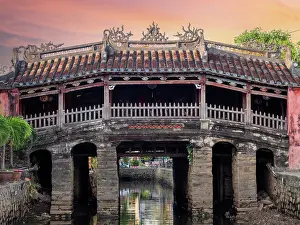 Landmark Japanese bridge by sunset golden hour in Hoi An, Vietnam