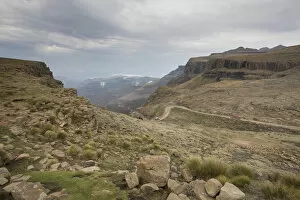 Images Dated 11th October 2009: Landscape shot of 4x4 vehicles driving Sani Pass on the border of KwaZulu-Natal