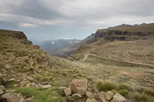 Climb Prints: Landscape shot of 4x4 vehicles driving Sani Pass on the border of KwaZulu-Natal