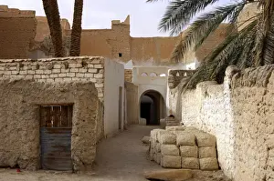 Bricks Prints: Lane with a pile of mud bricks in the backyards of the oasis of Ghadames