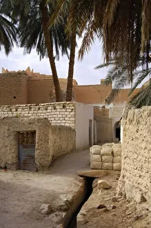 Adobe Collection: Lane with a pile of mud bricks in the backyards of the oasis of Ghadames, UNESCO world heritage