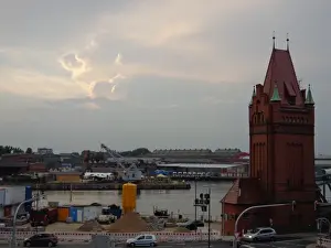 Lubeck Prints: LAOEbeck harbour impressive clouds, Germany