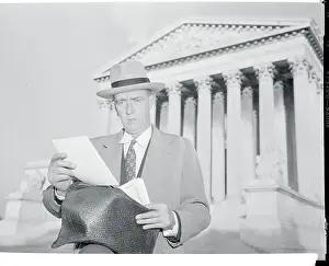 Joseph T Prints: Lar. J. Daly Reading in Front of Building